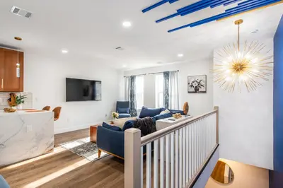 a living room with a couch and a tv at Apartment in Irvington Unit B in Irvington