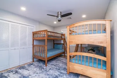a bedroom with two bunk beds and a ceiling fan at Private Mountain Retreat On 10 Acres The Perfect Family Escape in Cheshire
