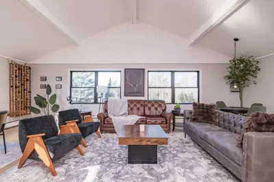 a living room with couches and a table at Private Mountain Retreat On 10 Acres The Perfect Family Escape in Cheshire
