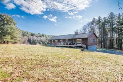 a house with a large field in front of it at Private Mountain Retreat On 10 Acres The Perfect Family Escape in Cheshire