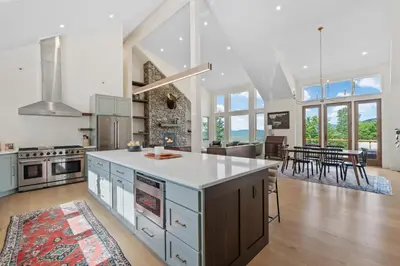 a kitchen with an island in the middle of a room at Windham Slopes - Ski-In-Out, Hot Tub & Fire Pit in Windham
