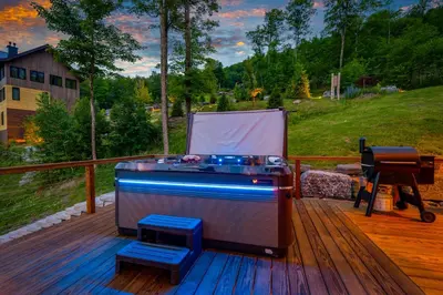 a ping pong game on a deck with two stools at Windham Slopes - Ski-In-Out, Hot Tub & Fire Pit in Windham