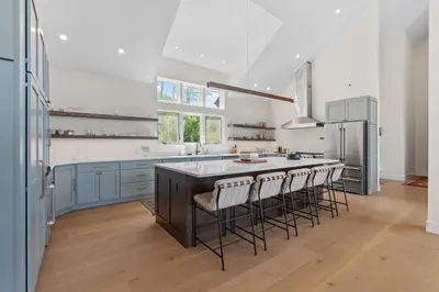 a kitchen with a large island with bar stools at Windham Slopes - Ski-In-Out, Hot Tub & Fire Pit in Windham
