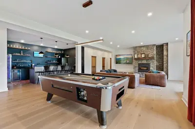 a living room with a pool table and a bar at Windham Slopes - Ski-In-Out, Hot Tub & Fire Pit in Windham