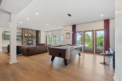 a living room with a pool table in it at Windham Slopes - Ski-In-Out, Hot Tub & Fire Pit in Windham