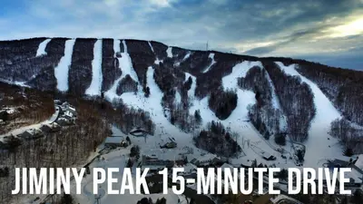a snow covered mountain with the words immunity peak minute drive at 13-Min Jiminy, Fave, Hot Tub, Lg Open LR, Family in Pittsfield