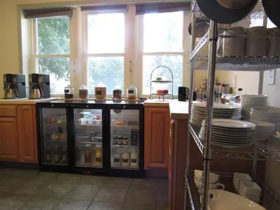 a kitchen with a refrigerator filled with food at Washington Park Inn in Albany