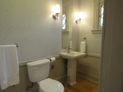 a bathroom with a toilet and a sink at Washington Park Inn in Albany