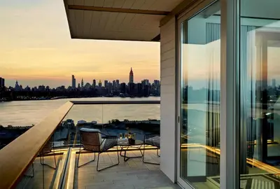 a balcony with a view of the city at The William Vale in Brooklyn