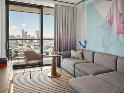 a living room with a couch and a table at The William Vale in Brooklyn