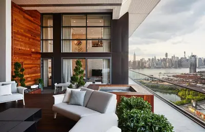 a living room with a view of the city at The William Vale in Brooklyn