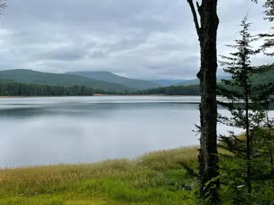 a view of a lake with mountains in the background at Fiber Artist's Studio in Woodstock