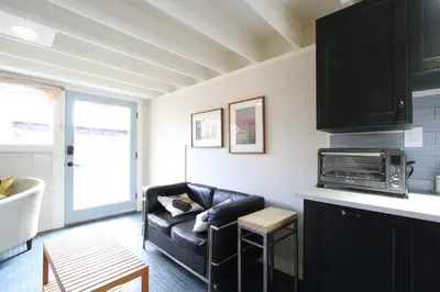 a living room with a couch and a microwave at Fiber Artist's Studio in Woodstock