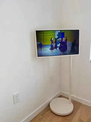 a flat screen tv hanging on a white wall at The Signature Modern Flat in Newark