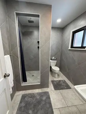 a bathroom with a shower and a toilet at Skyline Inn in Mount Pocono
