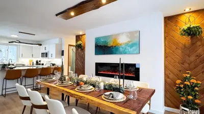a dining room with a table and a fireplace at Blackwood Cabin Pocono in Pocono Farms East