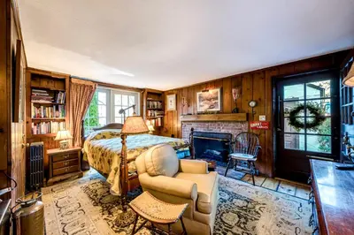 a bedroom with a bed and a fireplace at Highland Ave in Norwalk