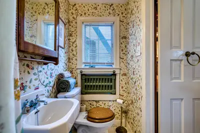 a small bathroom with a toilet and a sink at Highland Ave in Norwalk