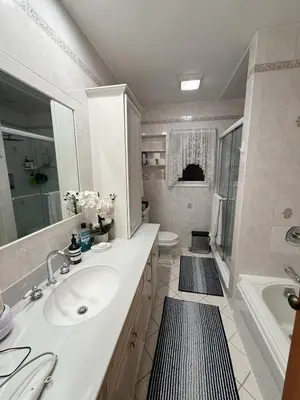 a bathroom with a sink and a tub and a toilet at House For Rent Near MetLife Stadium in Hasbrouck Heights