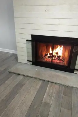 a fireplace with a fire in a room at World Cup Stay Close to MetLife Stadium NYC in Waldwick