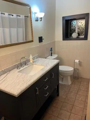 a bathroom with a sink and a toilet at Cozy Stay Near Jiminy Peak & Bousquet Mountain in New Lebanon