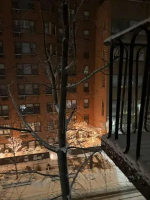 a view from a window of a building with a tree at Beautiful cozy place in HEART MANHATTAN in New York