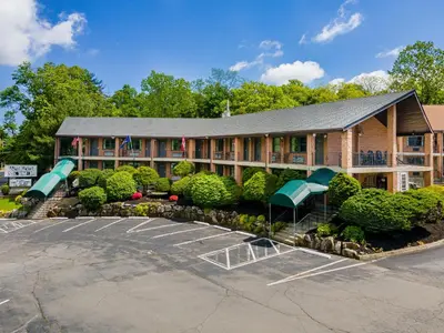 a building with a parking lot in front of it at West Point Motel in Highland Falls