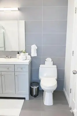 a bathroom with a white toilet and a sink at Yale Getaway Parking Wooster Square King Bed in New Haven