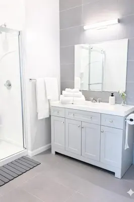 a white bathroom with a sink and a mirror at Yale Getaway Parking Wooster Square King Bed in New Haven