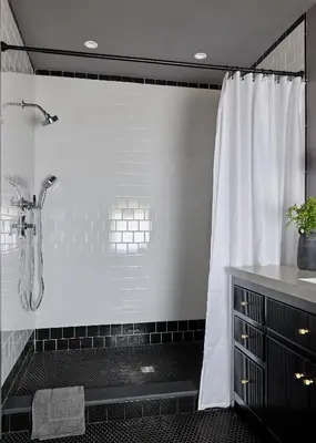 a bathroom with a shower with a white shower curtain at Eleanor Inn - Suite Amelia in Warwick