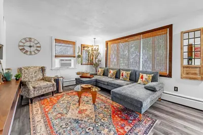 a living room with a couch and a table at 4 Bedroom House Near Bristol Center in Bristol