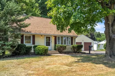 a house with a tree in front of it at 4 Bedroom House Near Bristol Center in Bristol