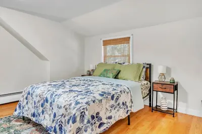 a white bedroom with a bed and a window at 4 Bedroom House Near Bristol Center in Bristol