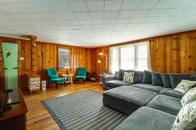 a living room with a gray couch and chairs at Year-Round Fun on Lake Sheridan! Home with Patio