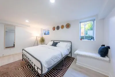 a white bedroom with a bed and a window at 2 Beds Sleeps 4 Near NYC and MetLife FIFA 2026 in Jersey City