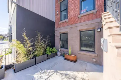 a building with plants on the side of it at 2 Beds Sleeps 4 Near NYC and MetLife FIFA 2026 in Jersey City