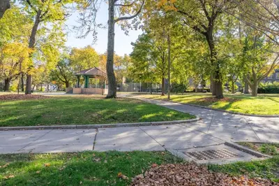 a path in a park with trees and a gazebo at 2 Beds Sleeps 4 Near NYC and MetLife FIFA 2026 in Jersey City