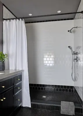 a bathroom with a shower with a shower curtain at Eleanor Inn - Suite Lorena in Warwick