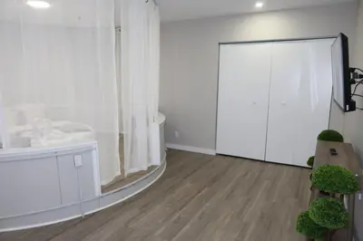 a white bathroom with a sink and a mirror at Chic 2BR Retreat in Albany Cozy, Stylish & Central in Albany