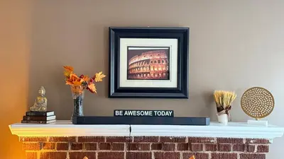 a fireplace with a picture on top of it at 2-Joint Large Deluxe Rooms in Private House - NYC in Sunnyside
