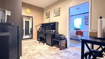 an office with a desk and a computer in a room at 2-Joint Large Deluxe Rooms in Private House - NYC in Sunnyside