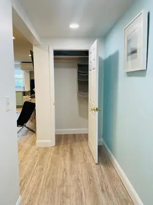 an empty room with a door and a closet at 2 Bedroom Garden Apartment Near Journal Square - Prime World Cup Lodging in Jersey City