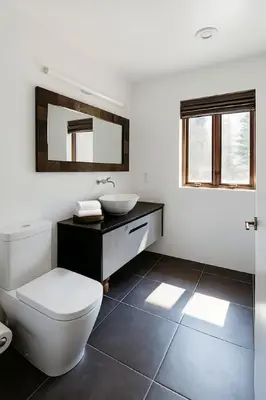 a bathroom with a white toilet and a sink at Drift Haus 4 and half BR Mountain Lodge in Windham