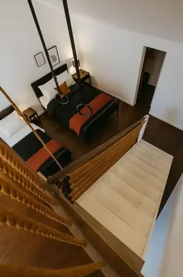 an overhead view of a stairs with a suitcase at Drift Haus 4 and half BR Mountain Lodge in Windham