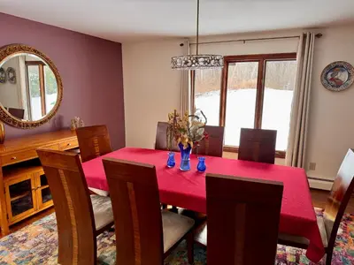 a dining room with a red table and chairs at Spacious 4BR Near Beaches WFH Office & Pool in Guilford