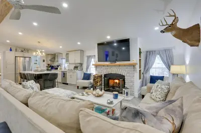 a living room with a couch and a fireplace at Hike and Explore! Nature-Centric Hudson Valley Home in Napanoch