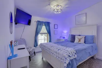 a purple bedroom with a bed and a desk at Hike and Explore! Nature-Centric Hudson Valley Home in Napanoch