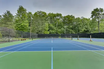 a tennis court with two tennis courts at Poconos Retreat in The Hideout Lake Community! in Lake Ariel