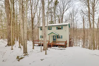 a tiny house in the woods in the snow at Poconos Retreat in The Hideout Lake Community! in Lake Ariel