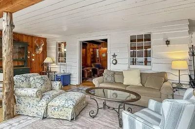 a living room with a couch and a table at Candlewood Isle in New Fairfield